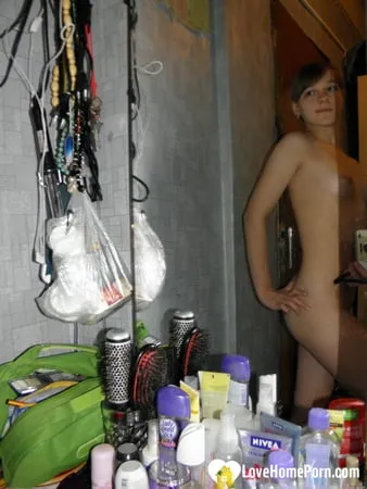 petite teen slowly strips off her clothes         