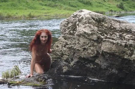 near a boulder in the river         