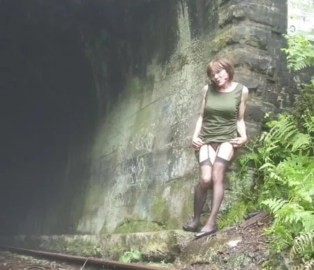 road trip to old train tunnel green dress         