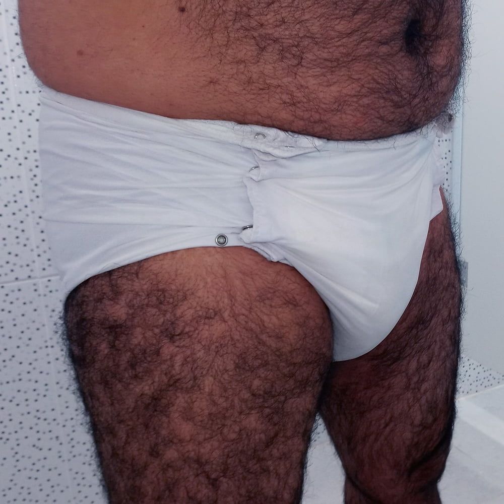 SHOWING WHITE DIAPER IN WORK BATHROOM. #3