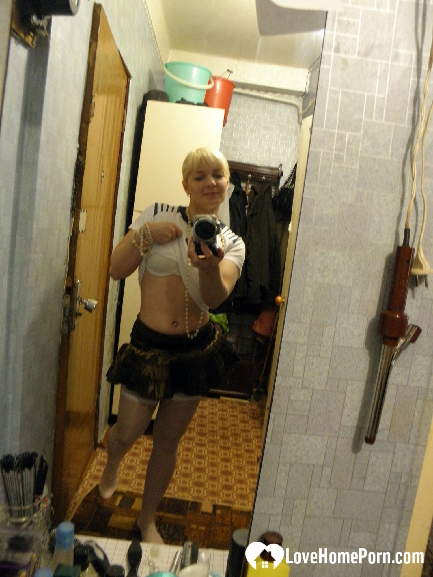 Aroused blonde in stockings taking naughty selfies #9