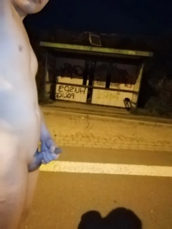 Naked at the bus stop at night