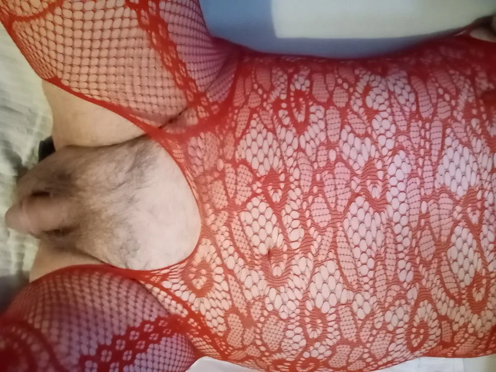 Lying back in red open crotch fishnets with dildo in rubbing #3