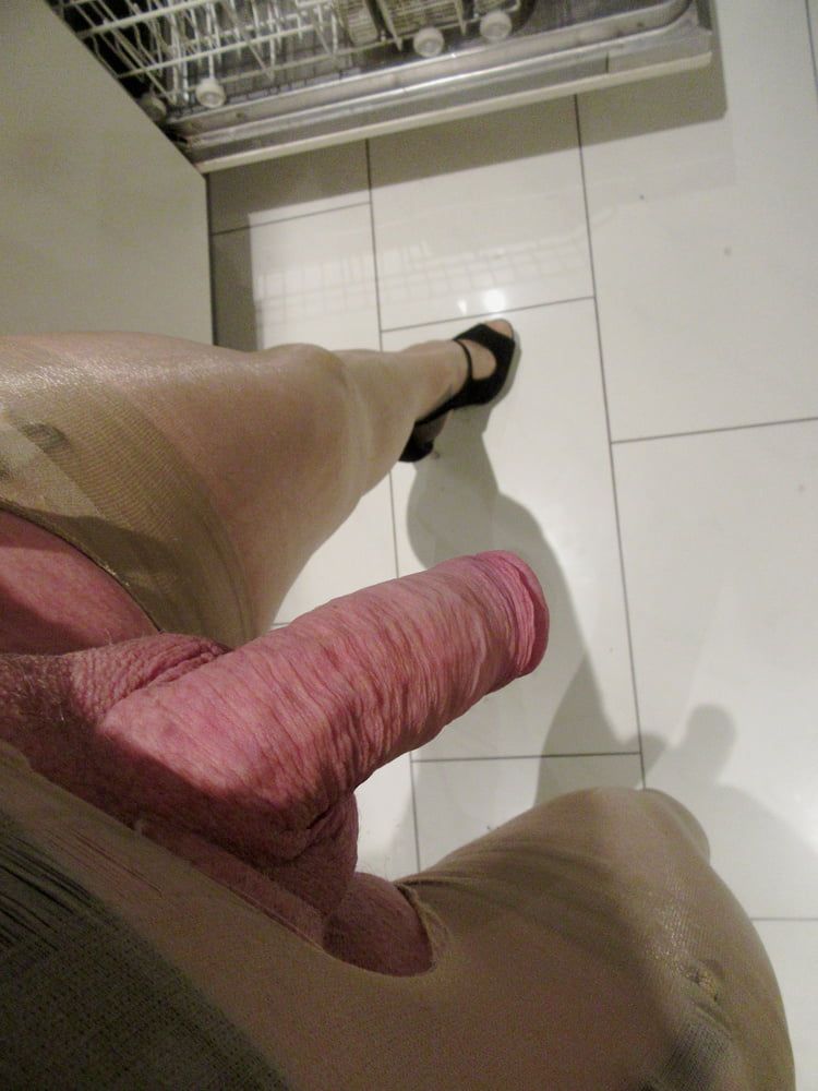 making the dishes in a nylon suit and black peeptoes #6