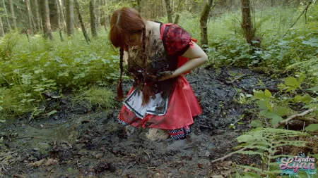 red riding hood in forest mud         