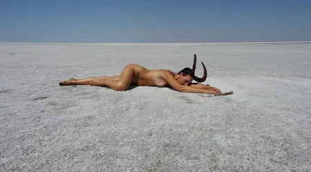 lying naked on the salt of the saltlake elton russia         