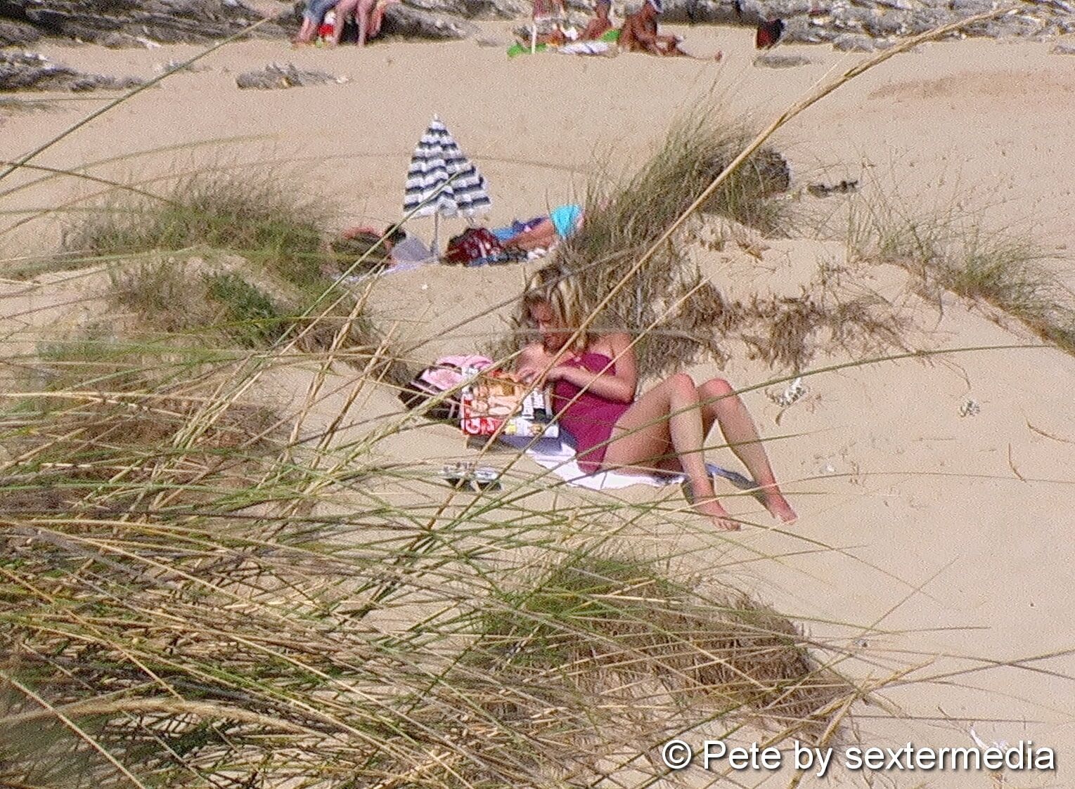 Milf feels unobserved on nudist beach #3