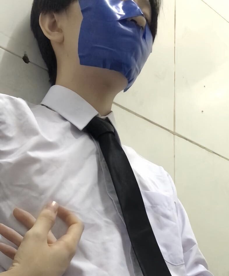 Wearing a white shirt and shiny black tie, gagged with duct  #26