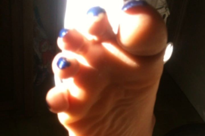 Blue toenails under sun ray #24