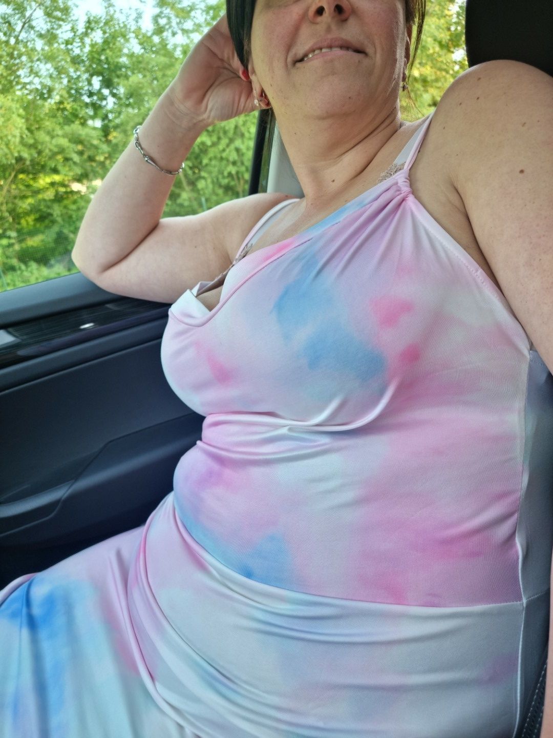 Busty milf showing her huge tits in car