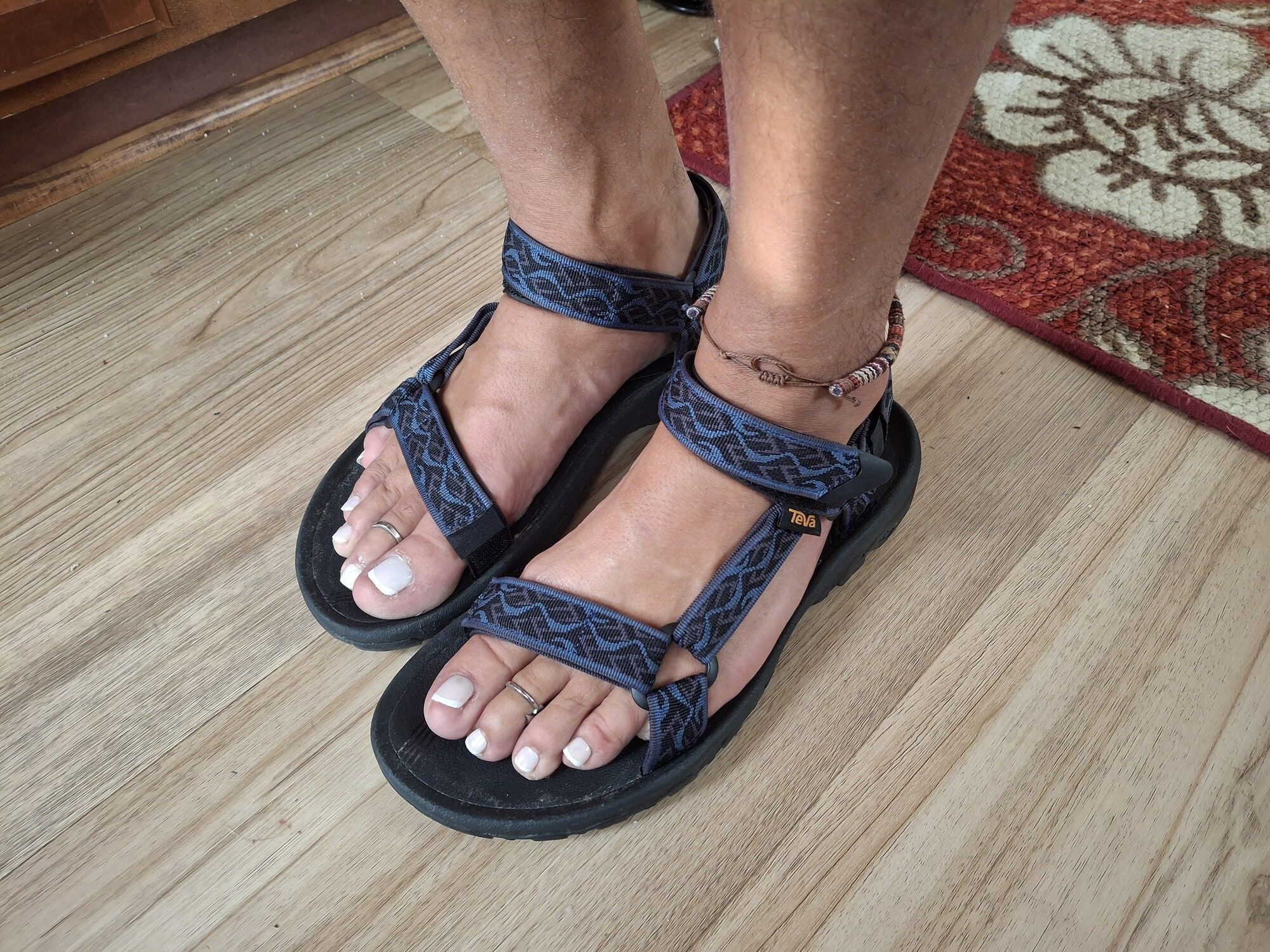 Sandals, nail polish and toe rings