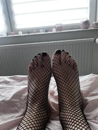 foot with fishnet socks         