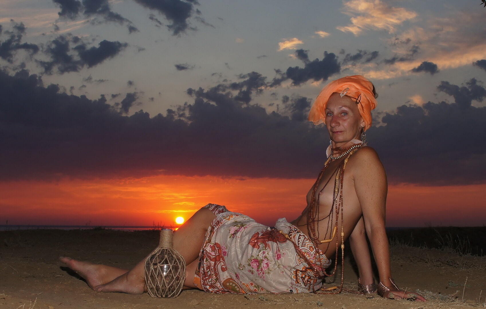 With a jug in the sunsetting sun