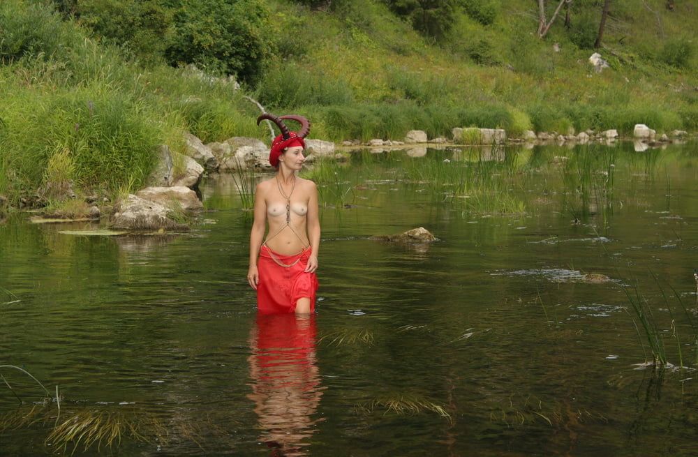 With Horns In Red Dress In Shallow River #13