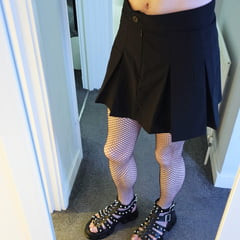 Femboy in fishnets