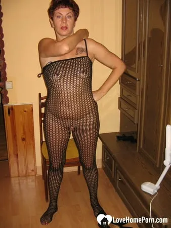 milf in a fishnet masturbates with a whip         