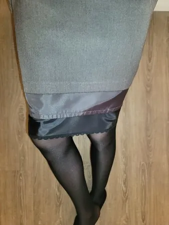 grey pencil skirt with black silky half slip         