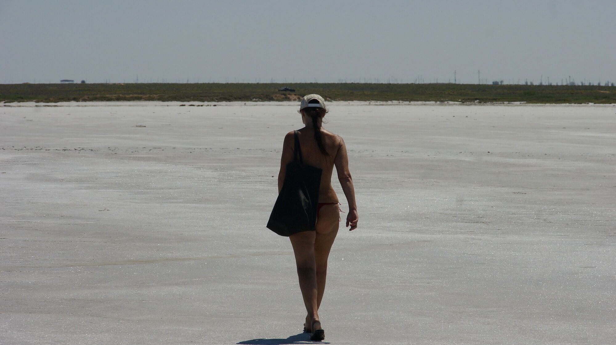 Standing naked on the salt of the salt lake Elton