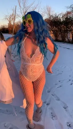 piss drinking pee outdoors in snow colored hair glasses         