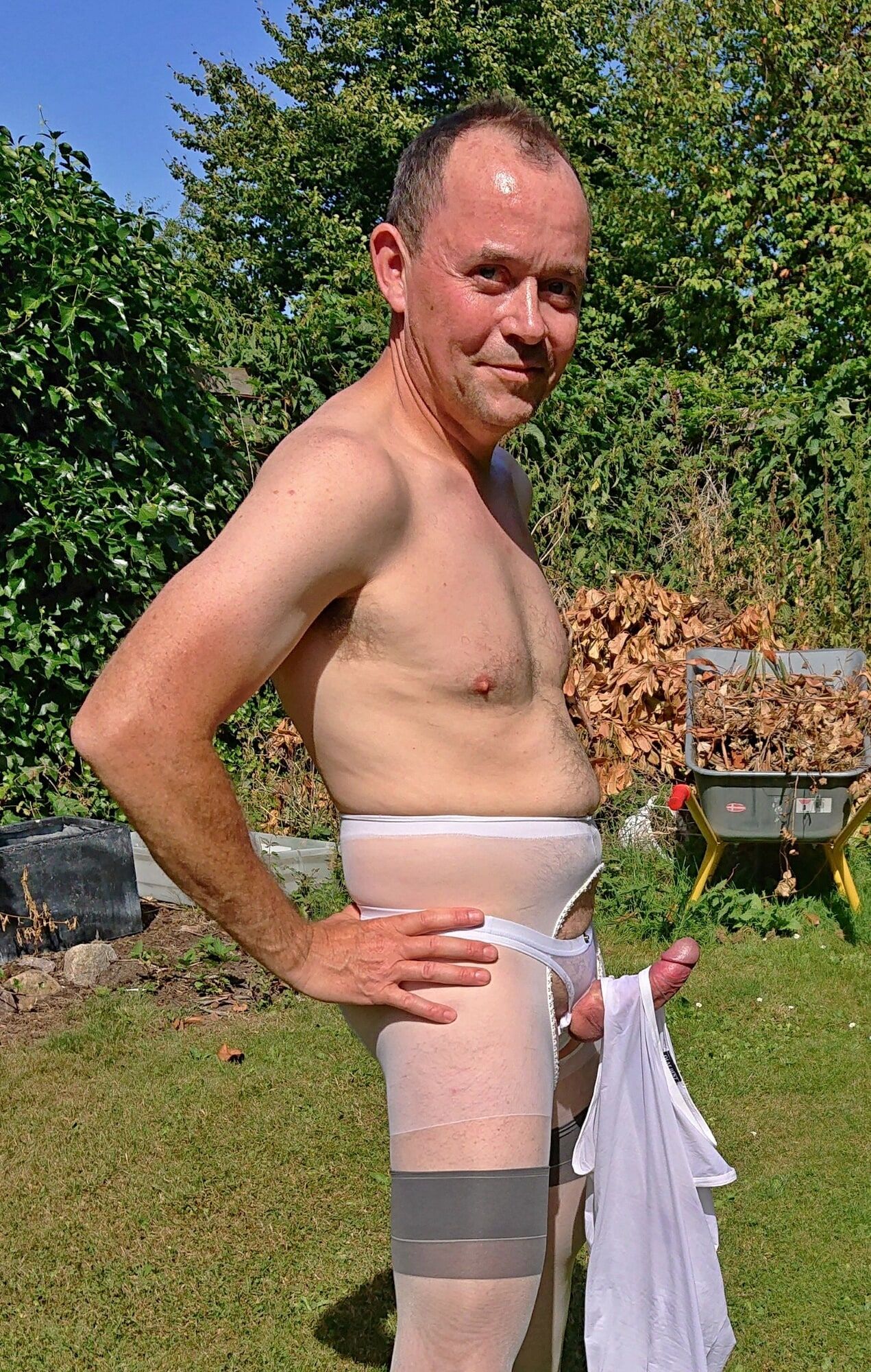 Posing in sexy nylon lingerie in a garden #27