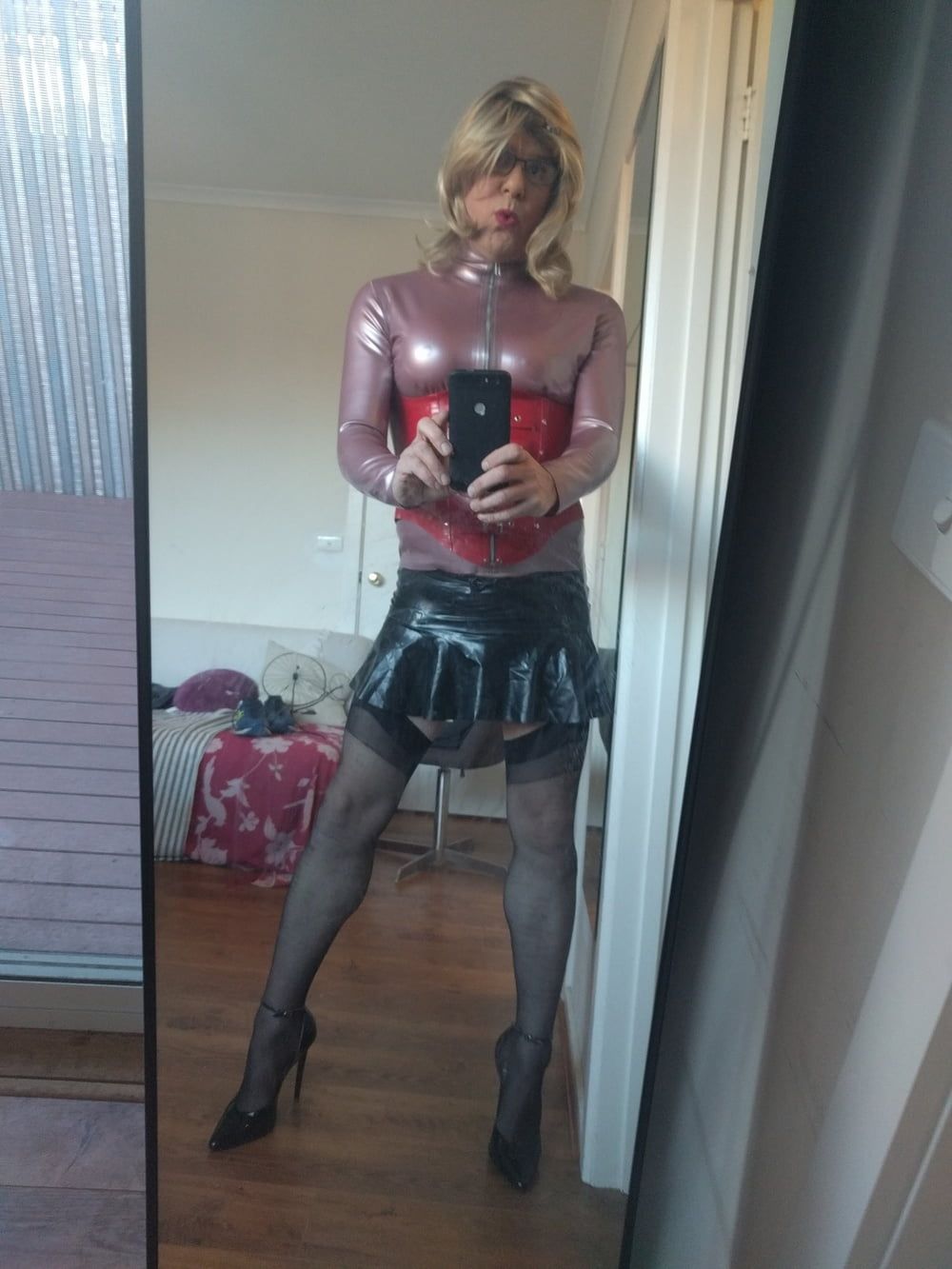 Back as a short blonde latex girl #4