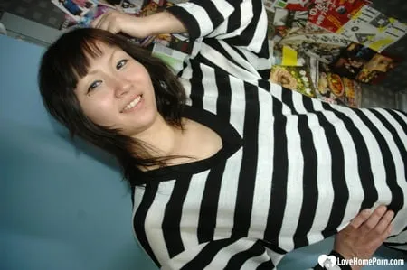 hot asian strips pantyhose and does sexy poses         