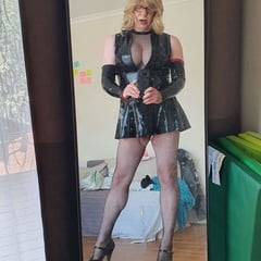 Rache wears a very short latex dress