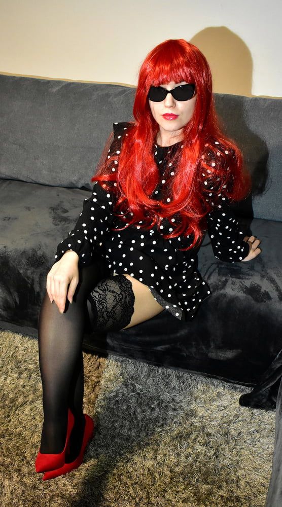 Redhead wife with black stockings and red high heels