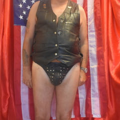 DRESSED IN BLACK TIGHT LEATHER.