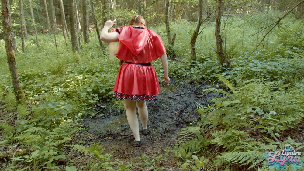 Red Riding hood in forest mud