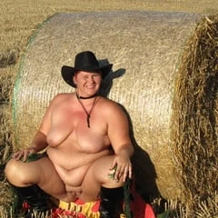 Anna naked on straw bales ...