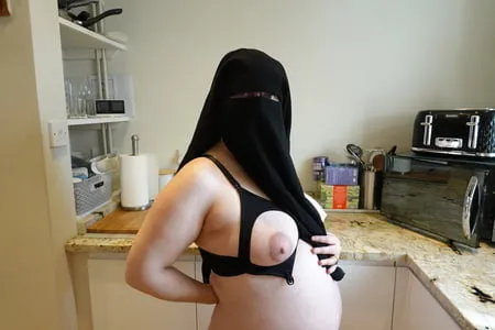 pregnant wife in muslim niqab and nursing bra         