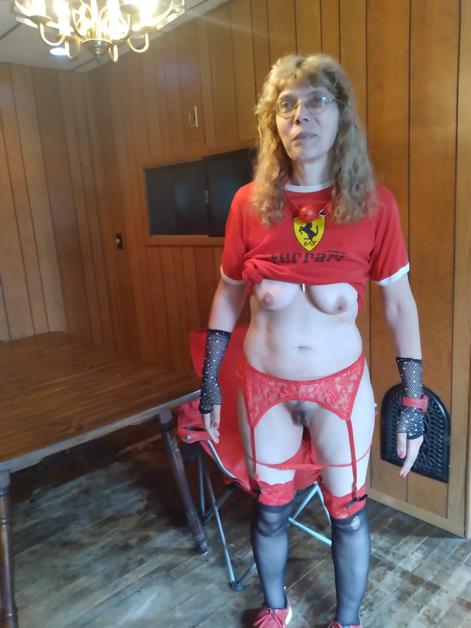 Red and black garters Ferrari outfit on breakfast table #11
