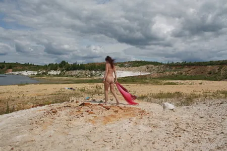 red shawl on white sand         