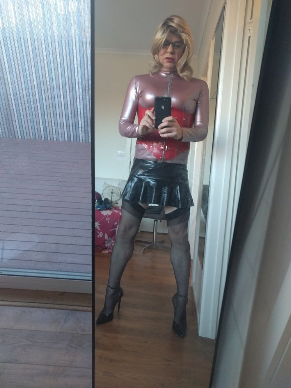 Back as a short blonde latex girl #3