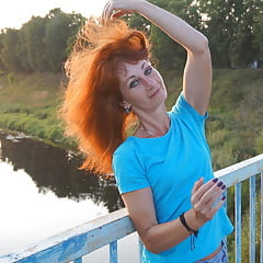 Flamehair in evening on the bridge