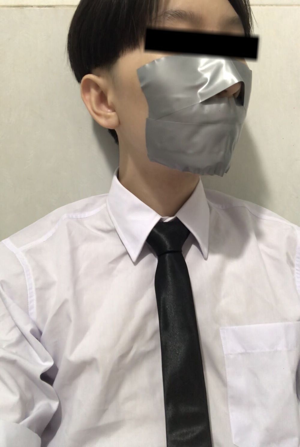 Wearing a white shirt and shiny black tie, gagged with duct  #8