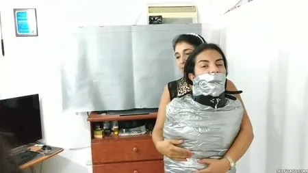 heavily duct tape mummified by crazy bondage women         