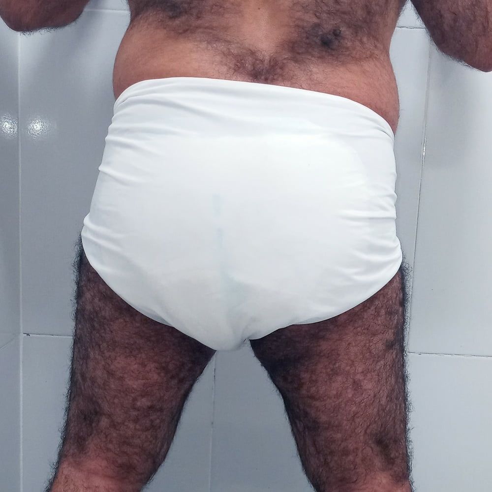 SHOWING WHITE DIAPER IN WORK BATHROOM. #9