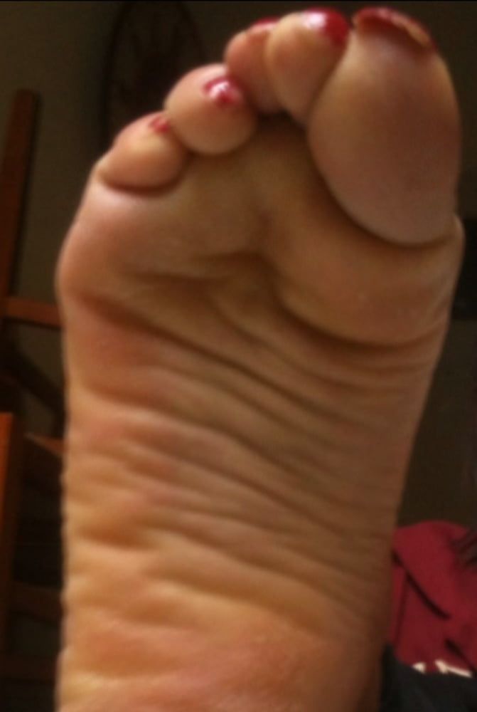 used red toenails, and soles feet after day at beach #28