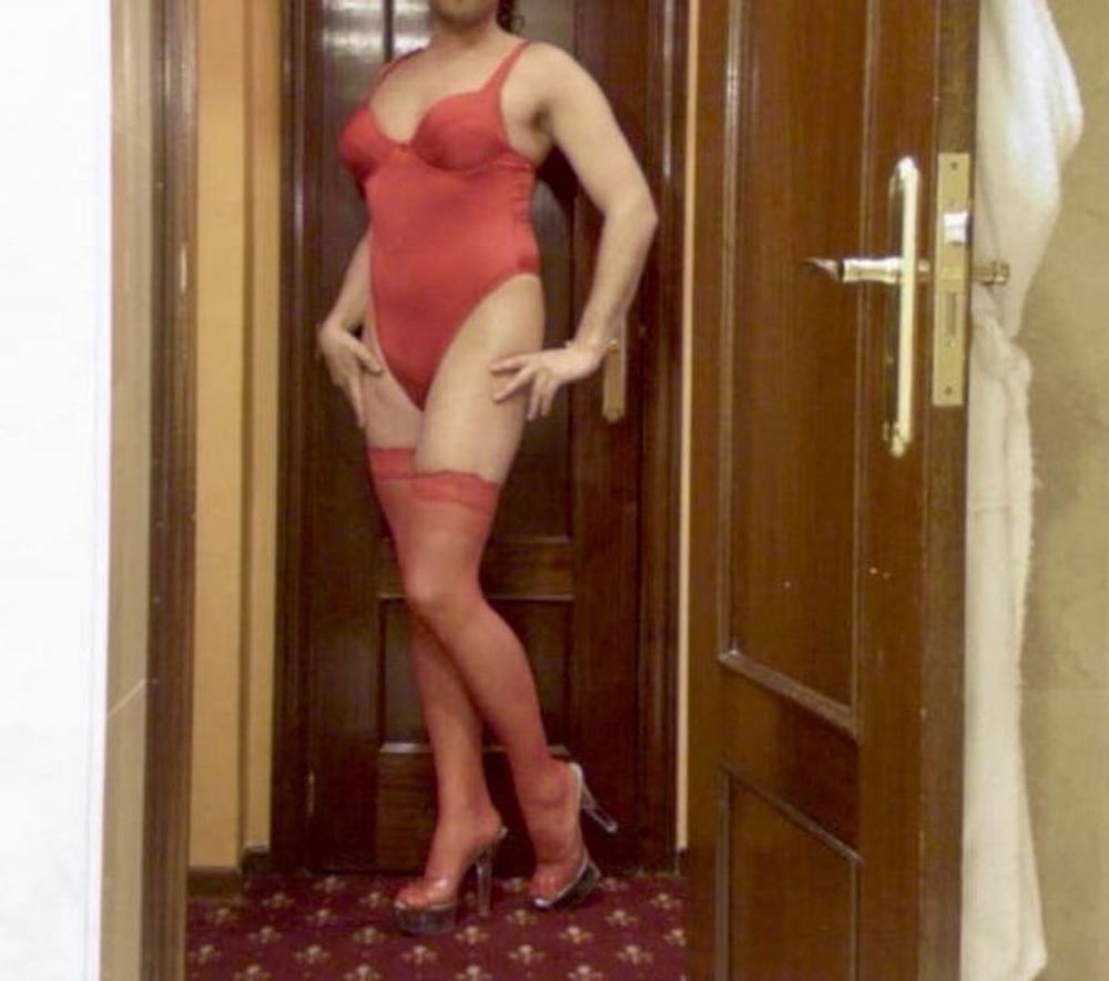 Wetting myself in my red body and stockings oops!