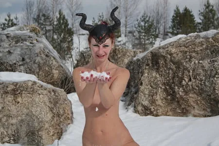 naked on snow in quarry         