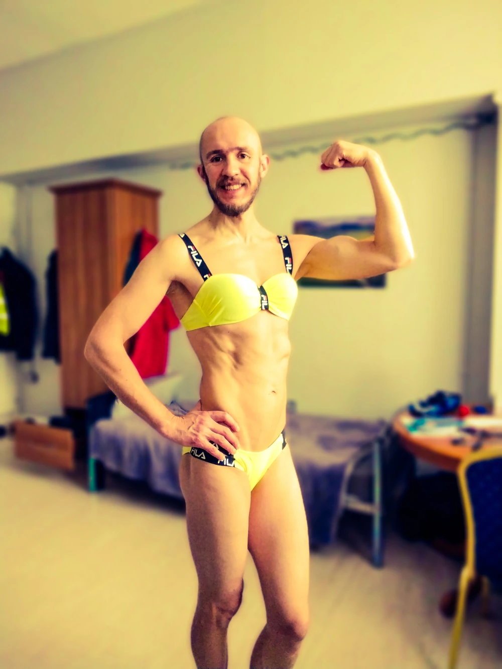 Bearded athletic man posing in yellow swimsuit  #4