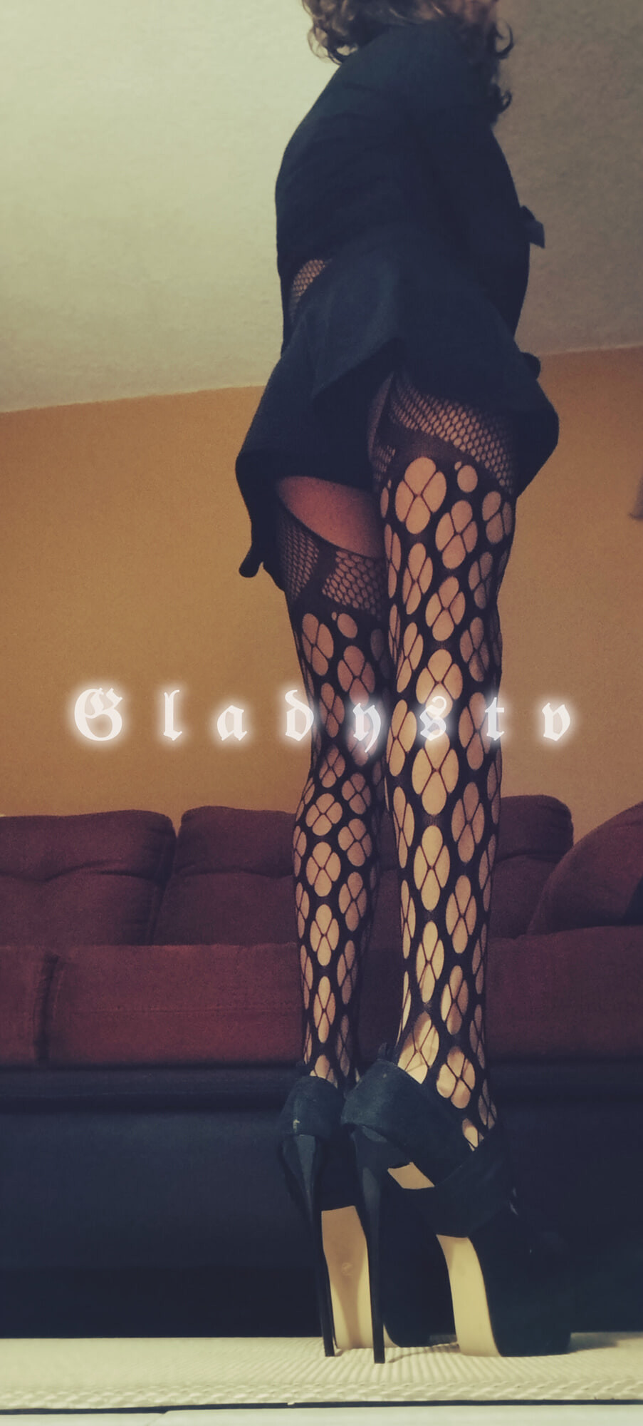 Transvestite in pantyhose and high heels