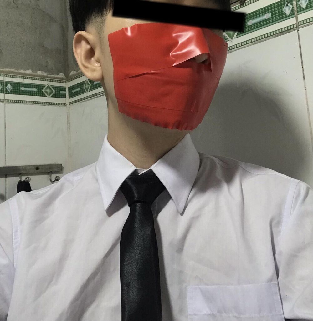 Wearing a white shirt and shiny black tie, gagged with duct  #13