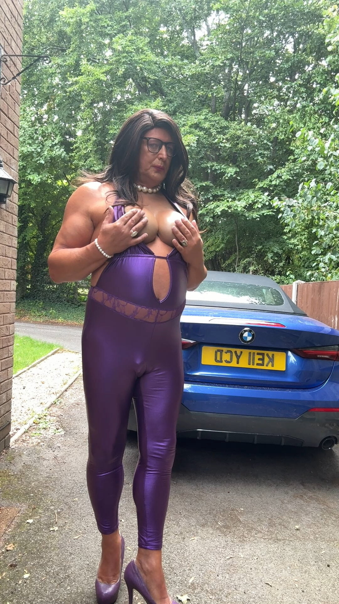 Sexy Crossdresser kellycd2022 in purple pvc catsuit and heel