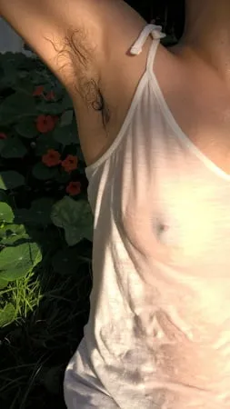 my beautiful hairy wife in wet t shirt in the garden         