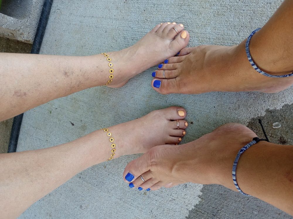 Showing off our pedicures in the pool #2