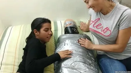 sexy girl trapped in ultra tight layered mummification         