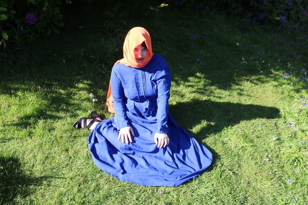 hijab and abaya flashing outdoors #13